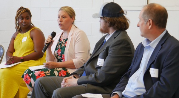 people at a conference in discussion
